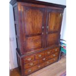 An early 18th century elm press cupboard of good colour;