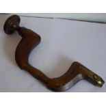A mid 19th Century patinated wood and brass bound wheel brace, circa 1860's,