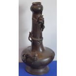 A heavy Chinese patinated bronze bottle-shaped vase; decorated in high-relief with Chilong dragons,