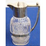 A fine quality cut glass and silver-mounted claret jug; hobnail engraved and of flattened oval form,