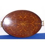An early-20th century mahogany serving tray; with marquetry allegorical of music,