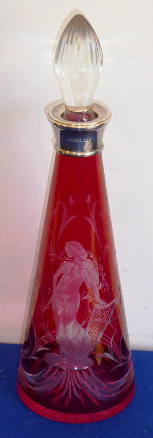 A modern conical flash-cut ruby glass decanter with silver collar;