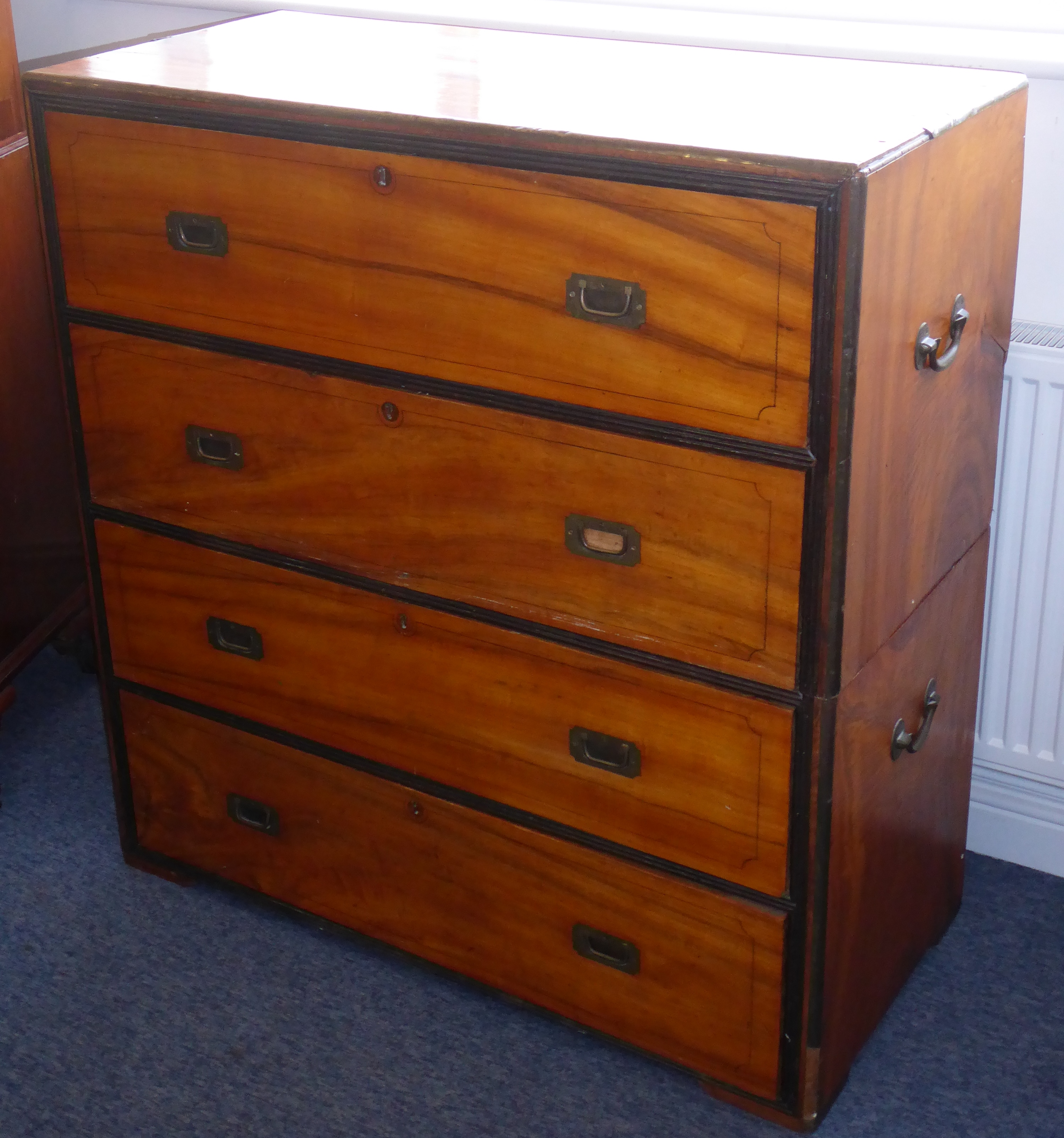 A 19th century two-part camphor wood military chest; four full-width drawers,