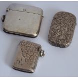 Three hallmarked silver vesta cases: one kidney shaped and unengraved (early 20th century);