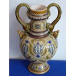 A late-19th century Mettlach two-handled stoneware vase; the handles modelled as scaly, fantastical,