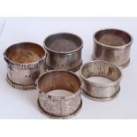 Five silver napkin rings of cylindrical section; various date, makers and assay marks etc.