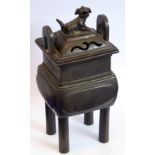 A heavy and darkly patinated bronze Fang Ding style Chinese censer;