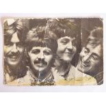 An original 1960s signed monochrome photograph of The Beatles (10cm x 15cm);