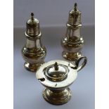 A pair of baluster-shaped sterling silver pepperettes marked Fisher,