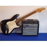 A Stratocaster-style electric guitar; black body and mother of pearl style pick-guard,