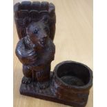 A late 19th century carved Black Forest match holder modelled as a standing grizzly bear with staff