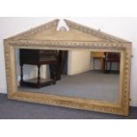 A large 19th Century wall hanging looking glass in the style of William Kent,