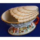A 19th century porcelain spoon-warmer modelled as a shell resting upon coral etc.