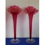 A large and impressive pair of early 20th century Jack in The Pulpit style Cranberry vases,