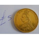 A Victorian gold five pound coin dated 1887 CONDITION REPORT: No coin mounting.