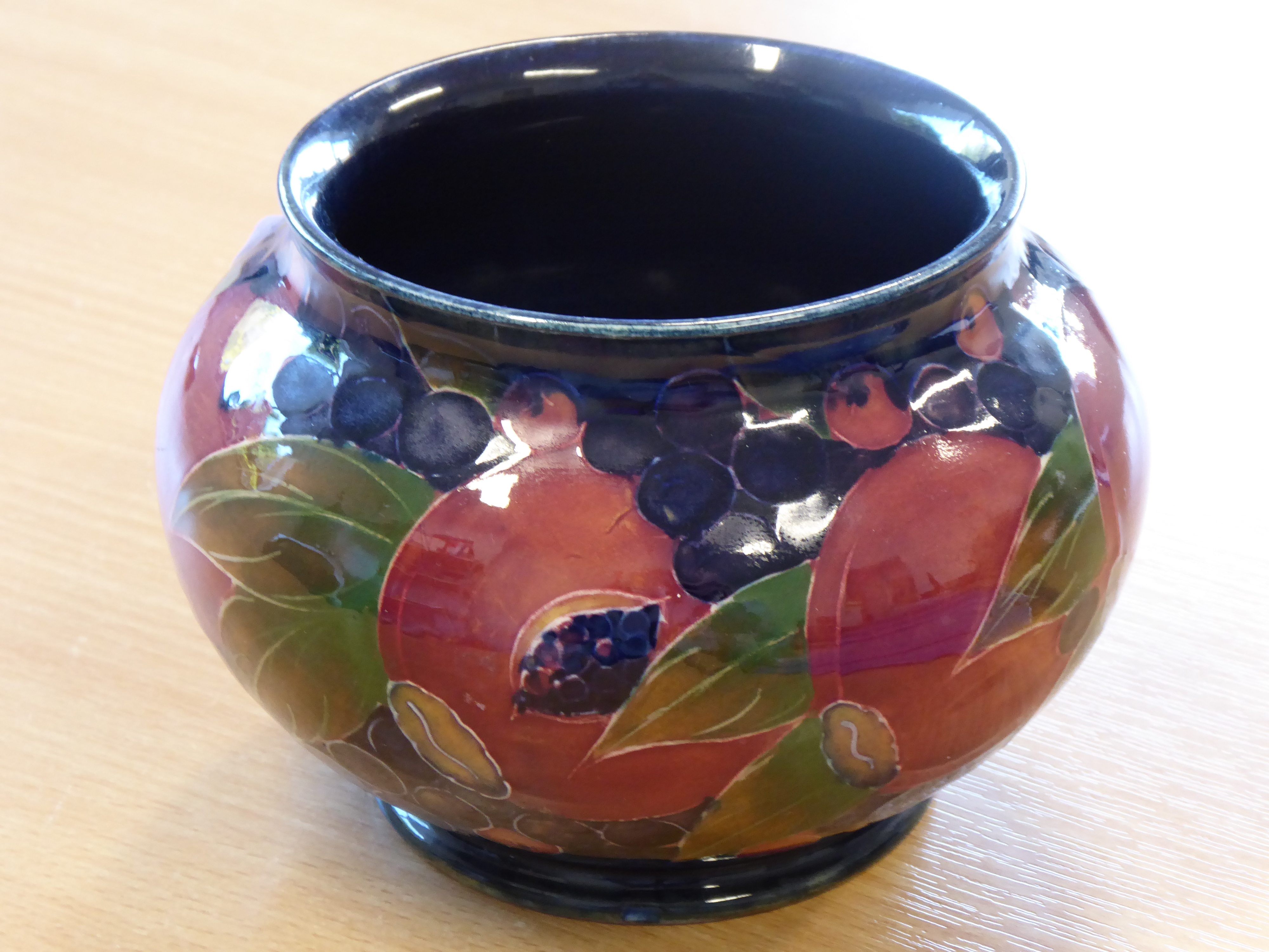 An early 20th century William Moorcroft pottery bowl of squat ovoid form,