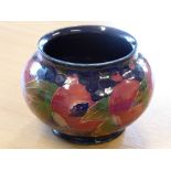 An early 20th century William Moorcroft pottery bowl of squat ovoid form,