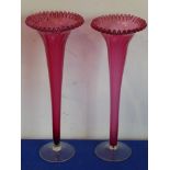 A pair of late 19th/early 20th century trumpet-shaped Cranberry glass vases with crimped edges, 33.