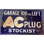 An early 20th century cobalt-blue and white enamel sign GARAGE 100 yds LEFT - AC PLUG STOCKIST