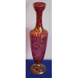 A 19th century Cranberry glass vase; hand-gilded with scrolling foliage, leaves etc.