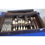 A faux crocodile cased white-metal flatware/cutlery service: various spoons, forks, knives,