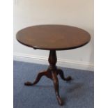 A George III period circular mahogany tilt-top occasional table,