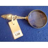 A silver-handled magnifying glass