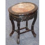 A 19th century Chinese carved hardwood and marble-inset oval jardiniere stand;