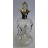 An Arts and Crafts style waisted decanter; spiral spire-shaped stopper;