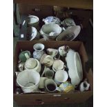 Two boxes of assorted ceramics including jugs, cups, plates etc.