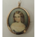 An early Victorian oval memorial brooch/pendant. The oval portrait painted on ivory panel, of a