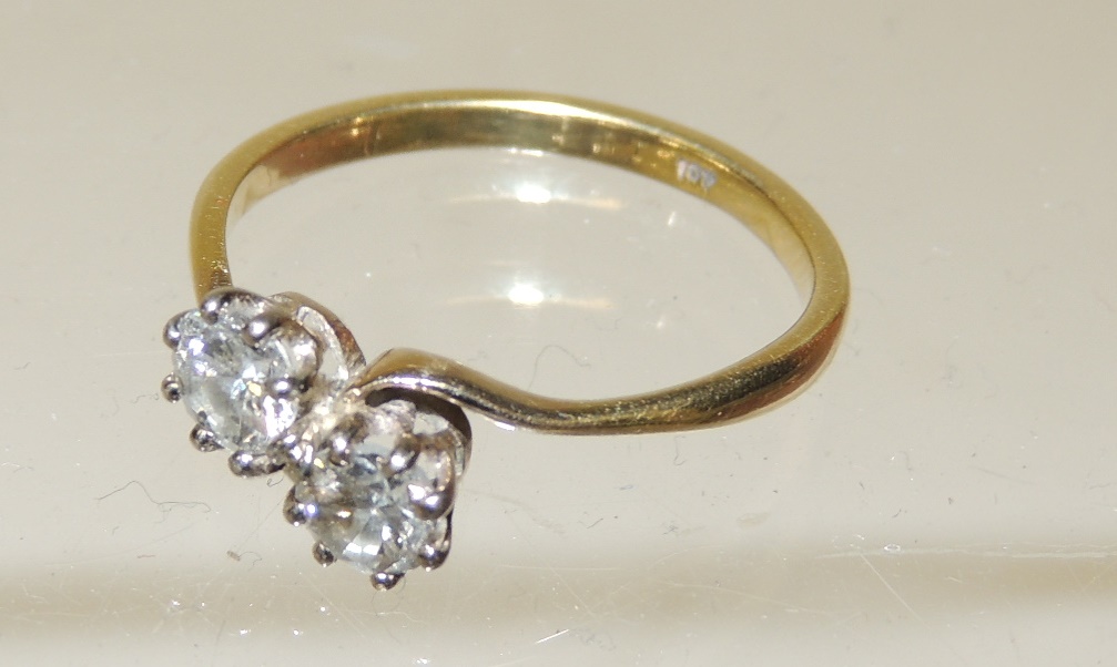 An 18ct gold two stone diamond cross-over ring, each diamond just under half a carat, size S. - Image 2 of 2