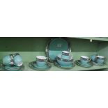 A green floral decorated edge part teaset.