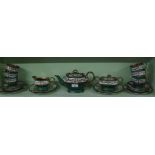 A hand painted green and gilt Japanese teaset.