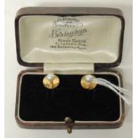 A pair of cased 18ct gold and cultured pearl dress studs.