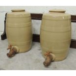 A pair of stoneware spirit barrels with original covers and wooden spigots, 31cms high