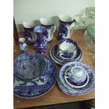 A collection of blue and white ceramics including three graduated jugs and a George Jones and Son