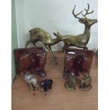 Two large stag and doe figures together with elephant book ends and figurines.