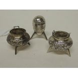 A Chinese silver three piece cruet in aesthetic style comprising two salts and a pepperette all on