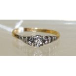 An 18ct gold illusion set solitaire diamond ring, openwork setting, size N.