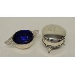 A small circular silver trinket box with plush lined interior and on three cabriol supports together