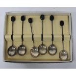 A set of six silver coffee spoons with bean terminals