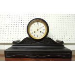 A Victorian mantel clock having circular white enamel dial, hour and half hour striking on a bell