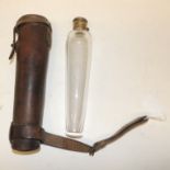 A conical glass hunting flask with twist-open silver plated top and in original brown leather case