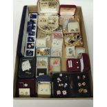 A large quantity of earrings for pierced ears, many different and some tie studs (a lot)