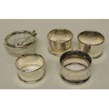 Four silver napkin rings total weight 1.6ozt together with a small circular cut glass salt with