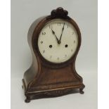 A late 19th Century mantel clock having cream painted dial, hour and half hour striking on a gong