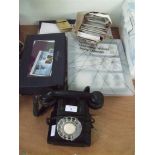 A quantity of assorted stamps; postcards together with telephone etc.