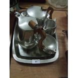 A Picquot ware tray together with teapot; coffee pot; milk jug and sugar.