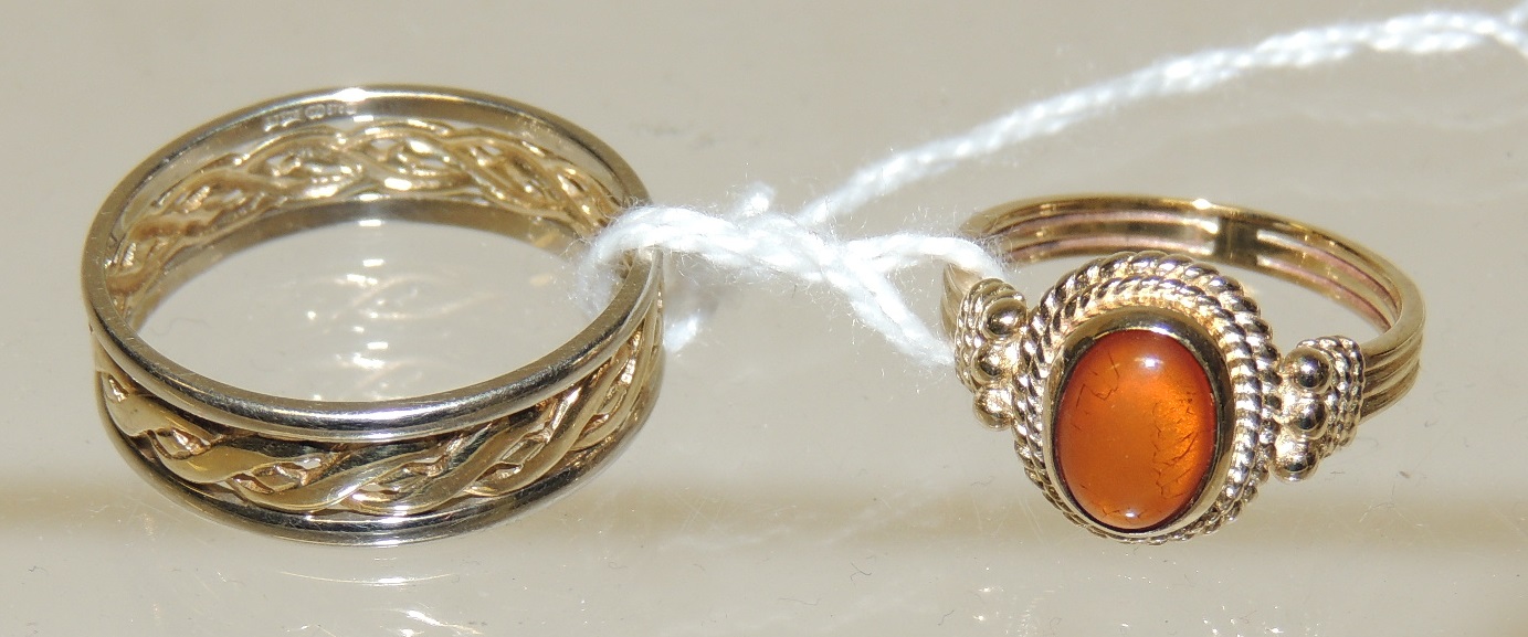A 9K gold ring, set with a cabochon amber coloured stone, size O; and another 9ct white and yellow